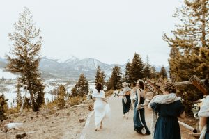 bride and bridesmaids on mountain trail
