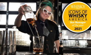bartender with 2021 icons of whiskey America bar manager of the year award